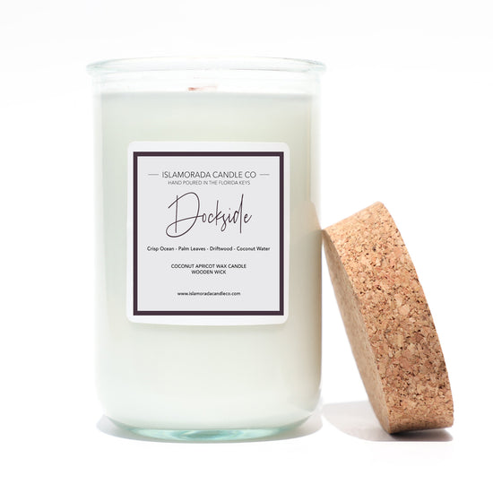 A Florida Keys inspired candle with wooden wick and Dockside scent notes in a 12oz vessel