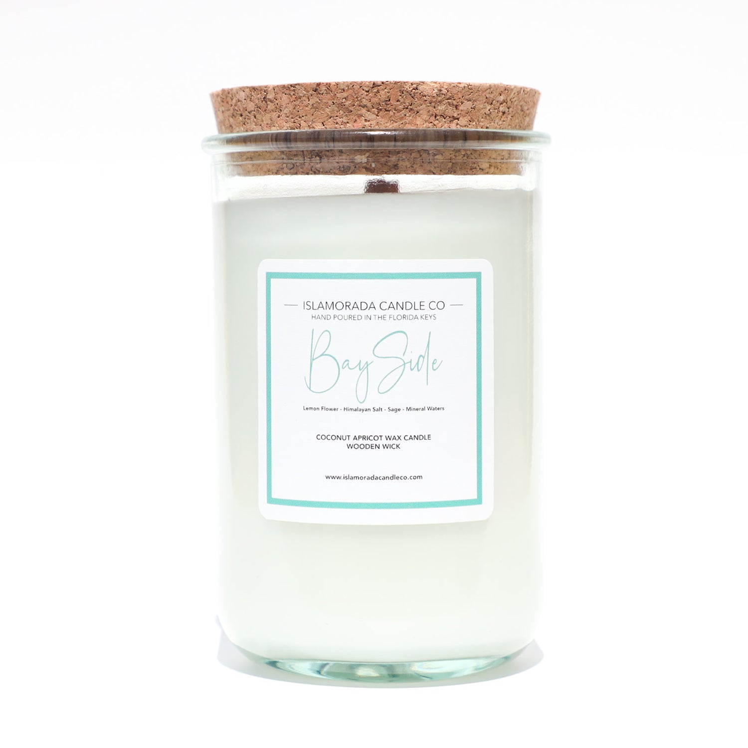A Florida Keys inspired candle with wooden wick and Bay Side scent notes in a 12oz vessel