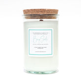 A Florida Keys inspired candle with wooden wick and Bay Side scent notes in a 12oz vessel