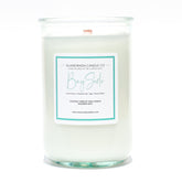 A Florida Keys inspired candle with wooden wick and Bay Side scent notes in a 12oz vessel