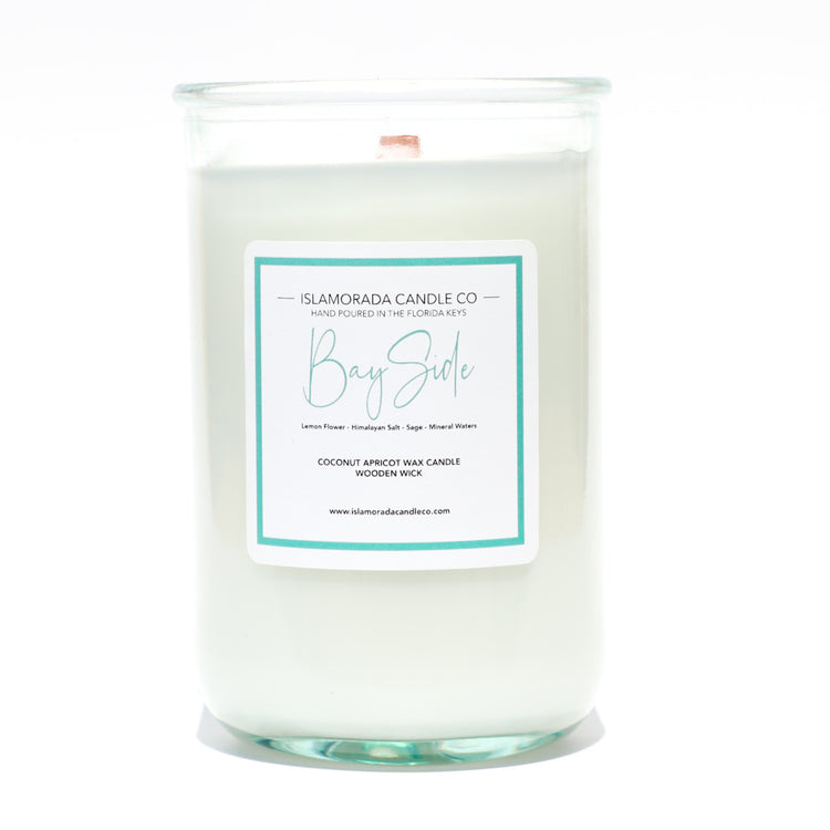 A Florida Keys inspired candle with wooden wick and Bay Side scent notes in a 12oz vessel