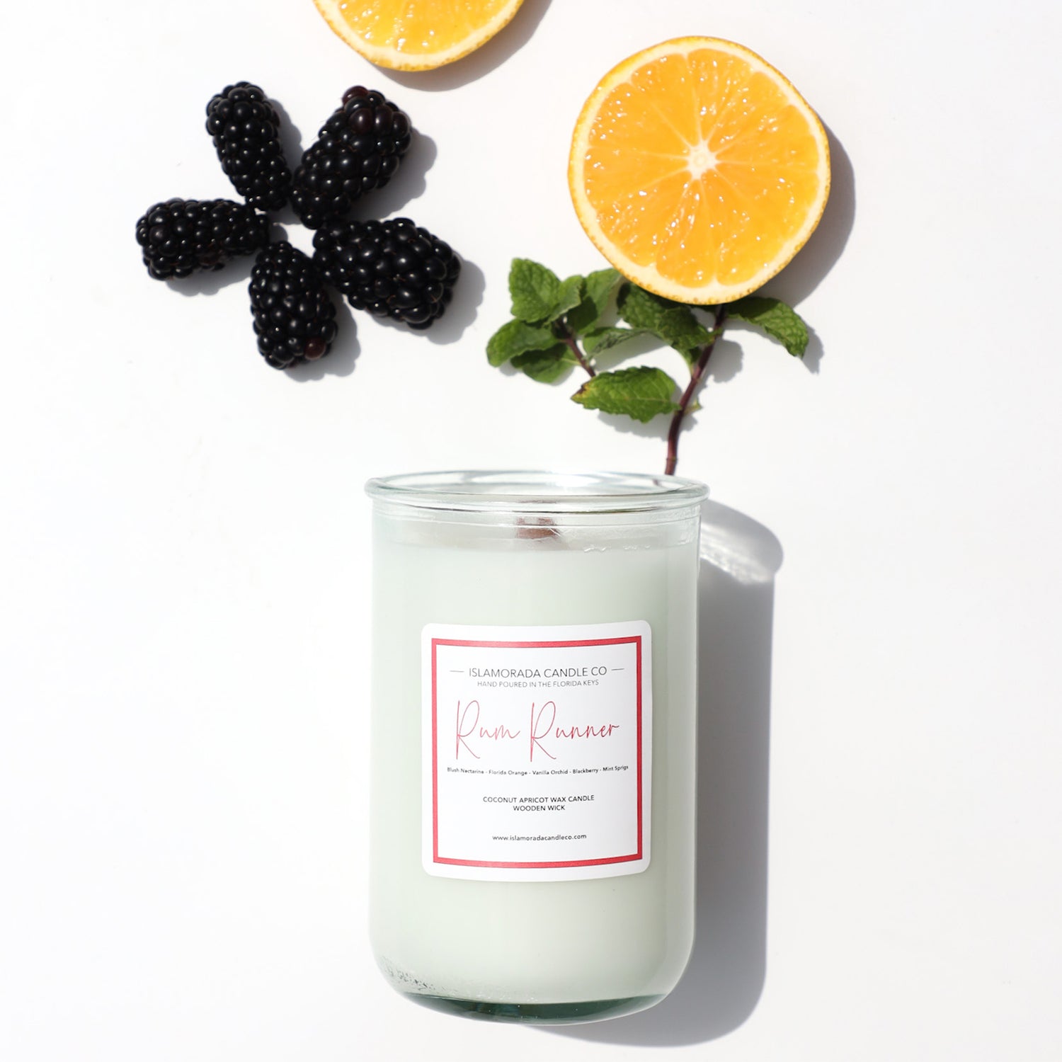 A Florida Keys inspired candle with wooden wick and Rum Runner scent notes in a 12oz vessel