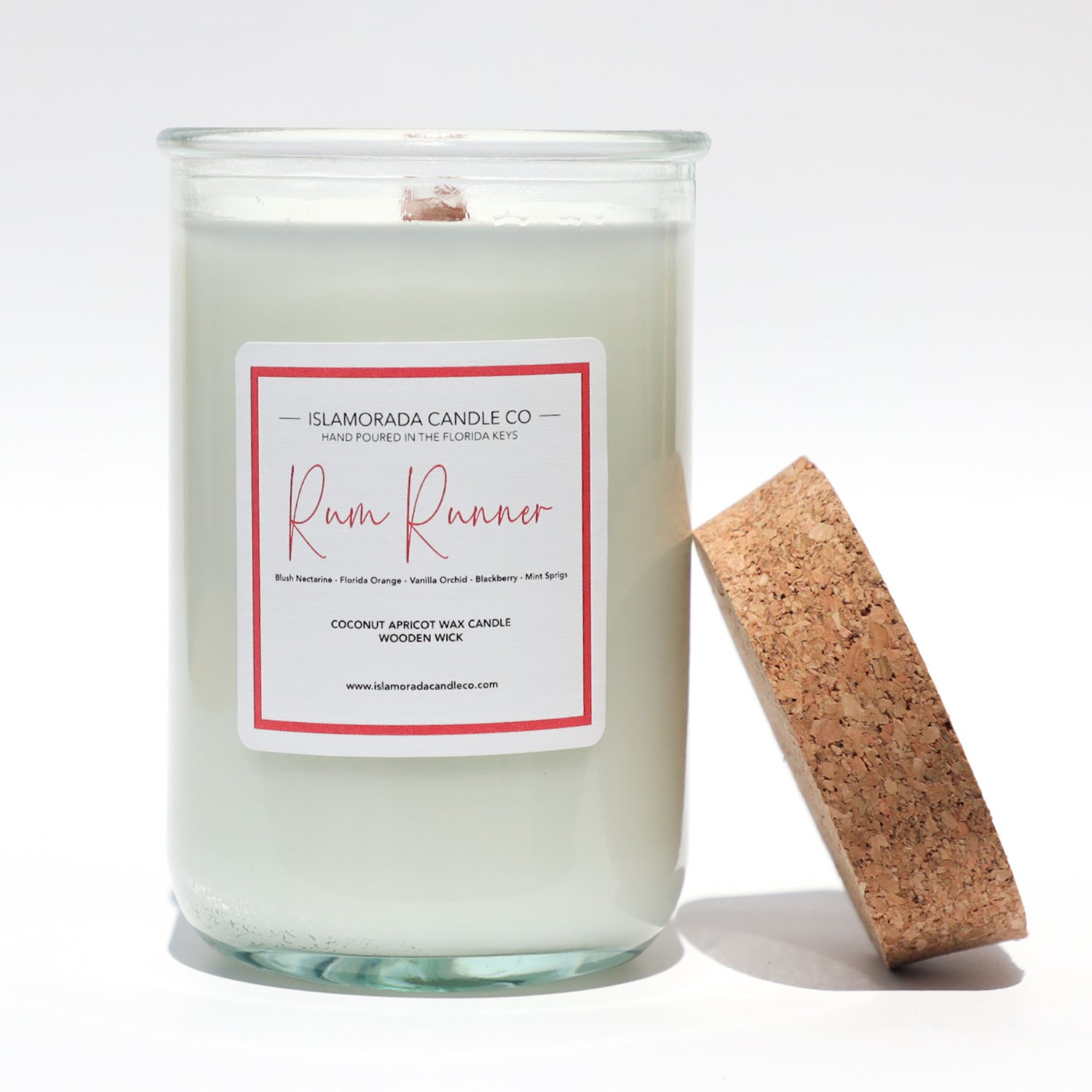 A Florida Keys inspired candle with wooden wick and Rum Runner scent notes in a 12oz vessel