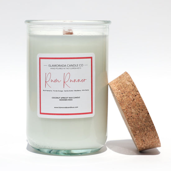 A Florida Keys inspired candle with wooden wick and Rum Runner scent notes in a 12oz vessel