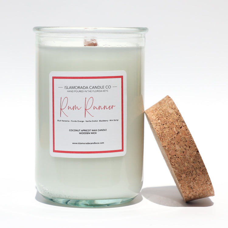 A Florida Keys inspired candle with wooden wick and Rum Runner scent notes in a 12oz vessel