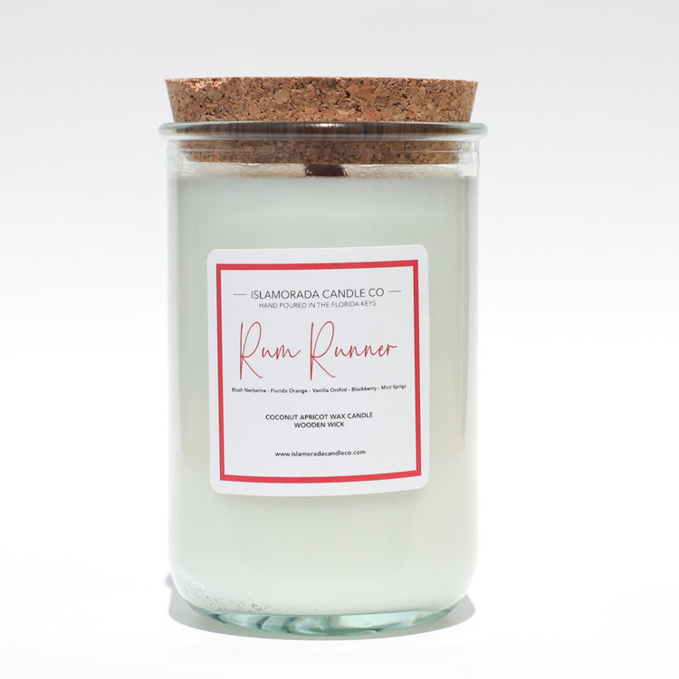 A Florida Keys inspired candle with wooden wick and Rum Runner scent notes in a 12oz vessel