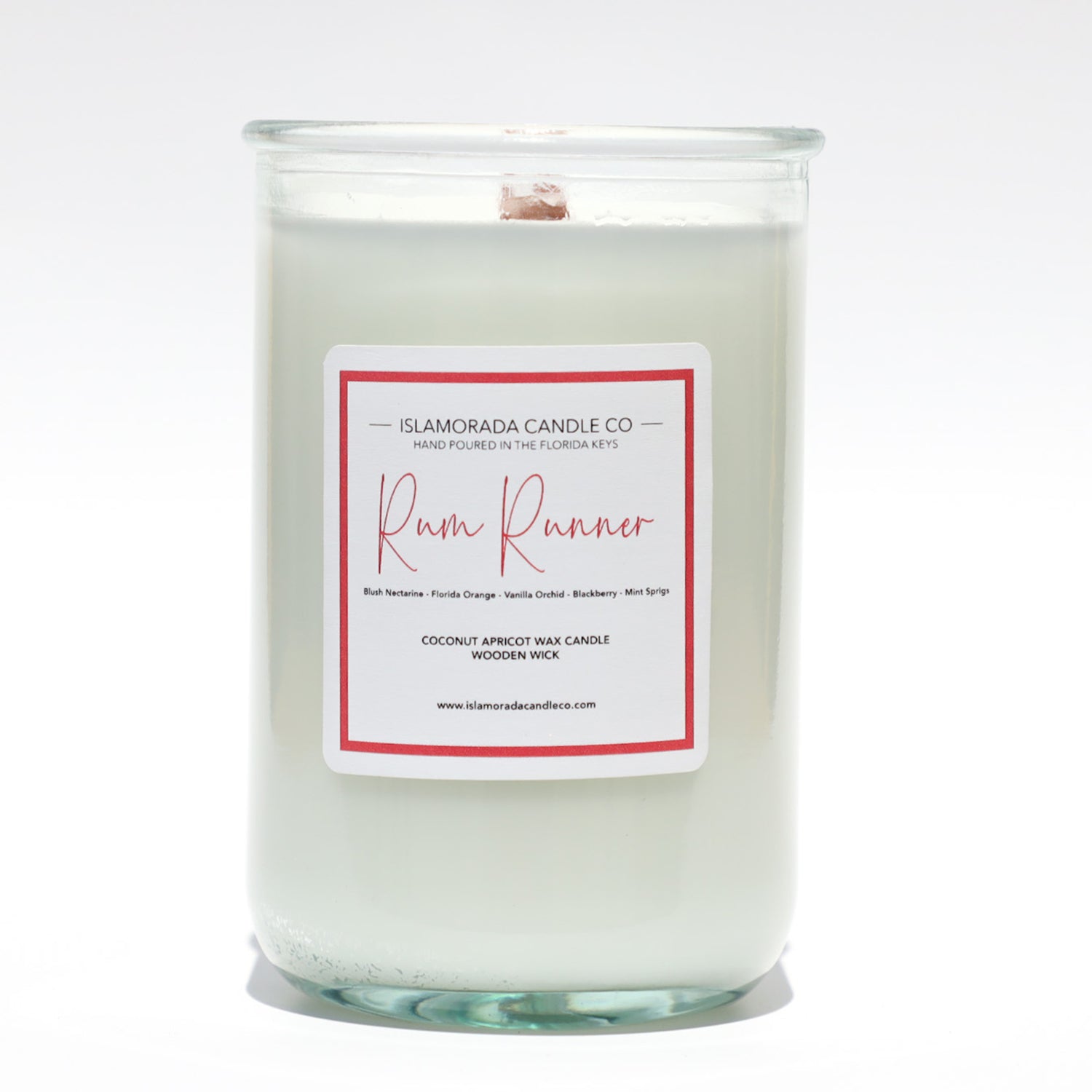 A Florida Keys inspired candle with wooden wick and Rum Runner scent notes in a 12oz vessel