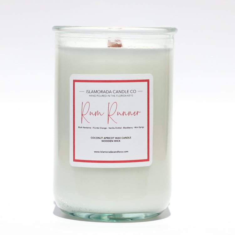 A Florida Keys inspired candle with wooden wick and Rum Runner scent notes in a 12oz vessel