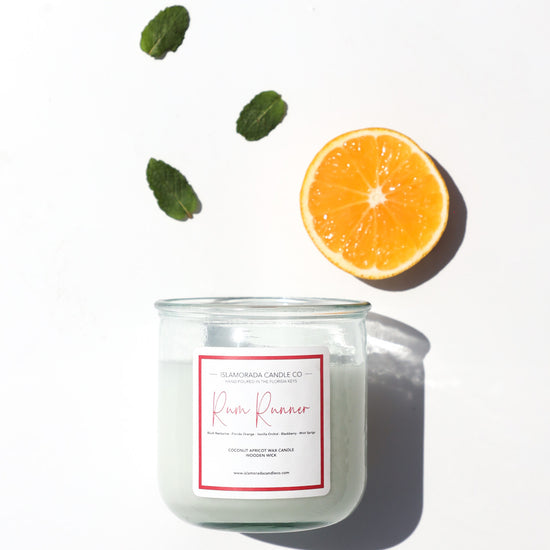 A Florida Keys inspired candle with wooden wick and Rum Runner scent notes