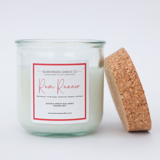 A Florida Keys inspired candle with wooden wick and Rum Runner scent notes