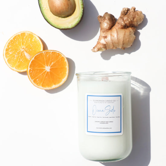 A Florida Keys inspired candle with wooden wick and Oceanside scent notes in a 12oz vessel