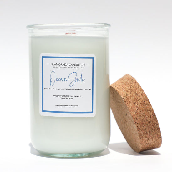A Florida Keys inspired candle with wooden wick and Oceanside scent notes in a 12oz vessel