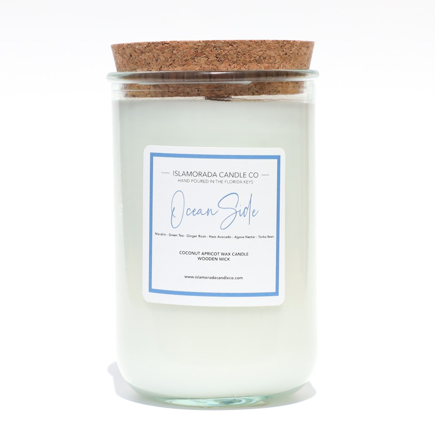 A Florida Keys inspired candle with wooden wick and Oceanside scent notes in a 12oz vessel