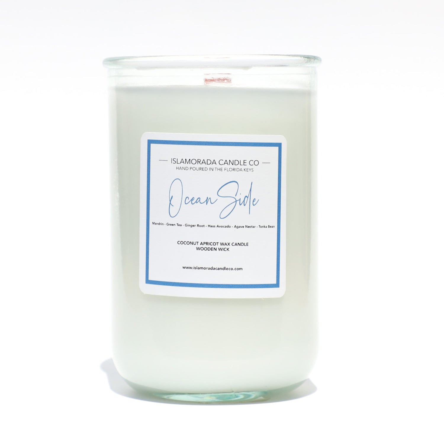 A Florida Keys inspired candle with wooden wick and Oceanside scent notes in a 12oz vessel