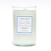 A Florida Keys inspired candle with wooden wick and Oceanside scent notes in a 12oz vessel