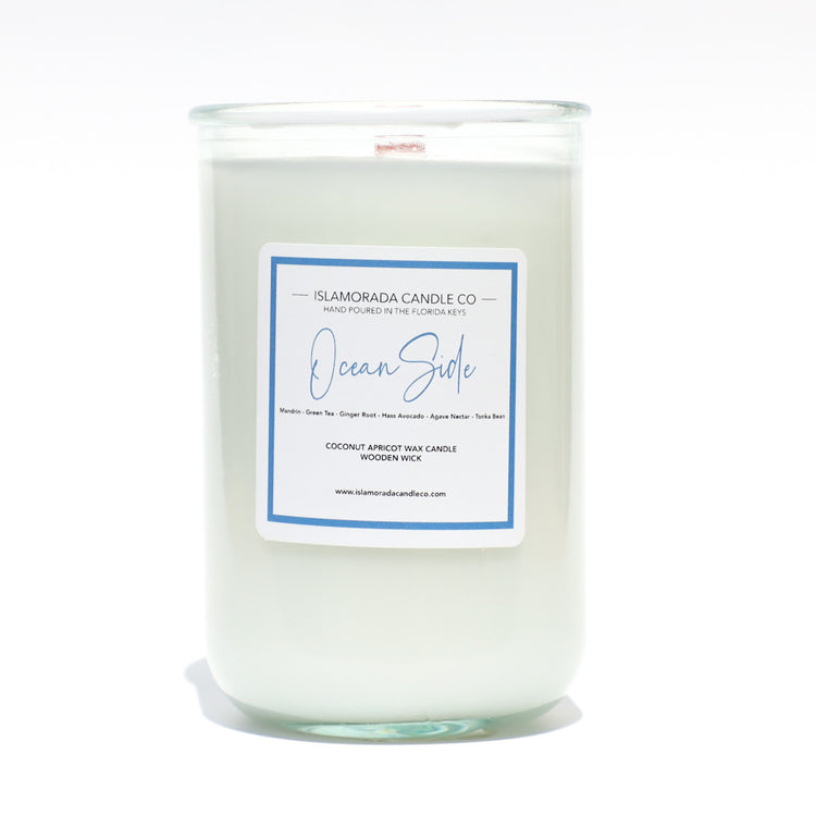 A Florida Keys inspired candle with wooden wick and Oceanside scent notes in a 12oz vessel