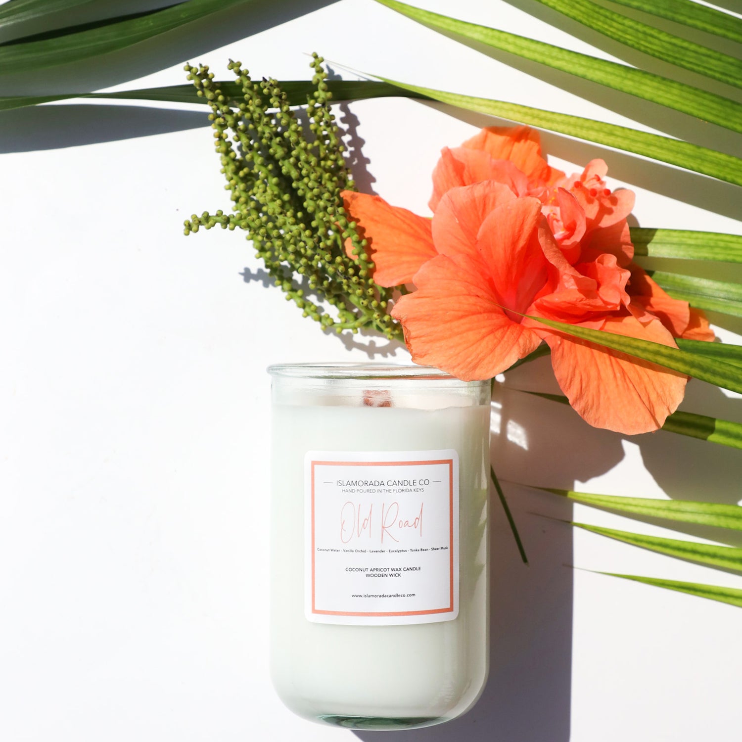 A Florida Keys inspired candle with wooden wick and Old Road scent notes in a 12oz vessel
