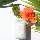 A Florida Keys inspired candle with wooden wick and Old Road scent notes in a 12oz vessel