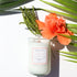 A Florida Keys inspired candle with wooden wick and Old Road scent notes in a 12oz vessel