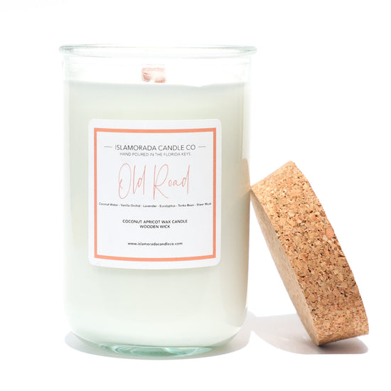A Florida Keys inspired candle with wooden wick and Old Road scent notes in a 12oz vessel