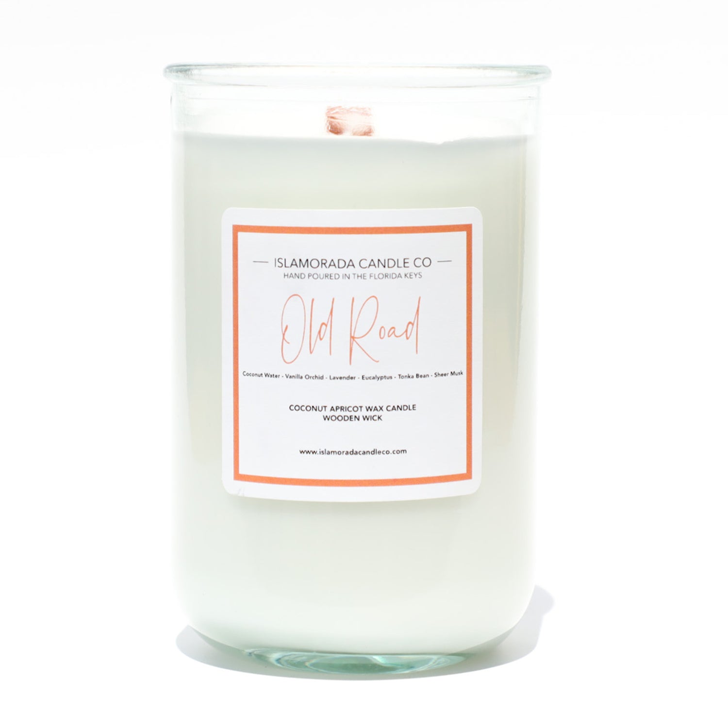 A Florida Keys inspired candle with wooden wick and Old Road scent notes in a 12oz vessel