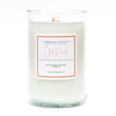 A Florida Keys inspired candle with wooden wick and Old Road scent notes in a 12oz vessel
