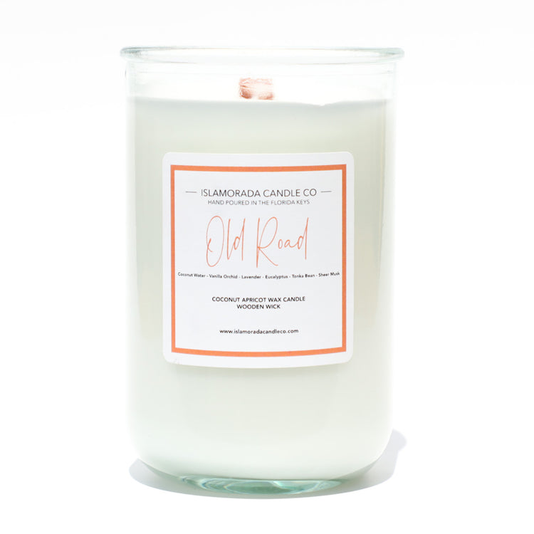 A Florida Keys inspired candle with wooden wick and Old Road scent notes in a 12oz vessel