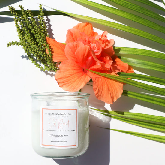 A Florida Keys inspired candle with wooden wick and Old Road scent notes