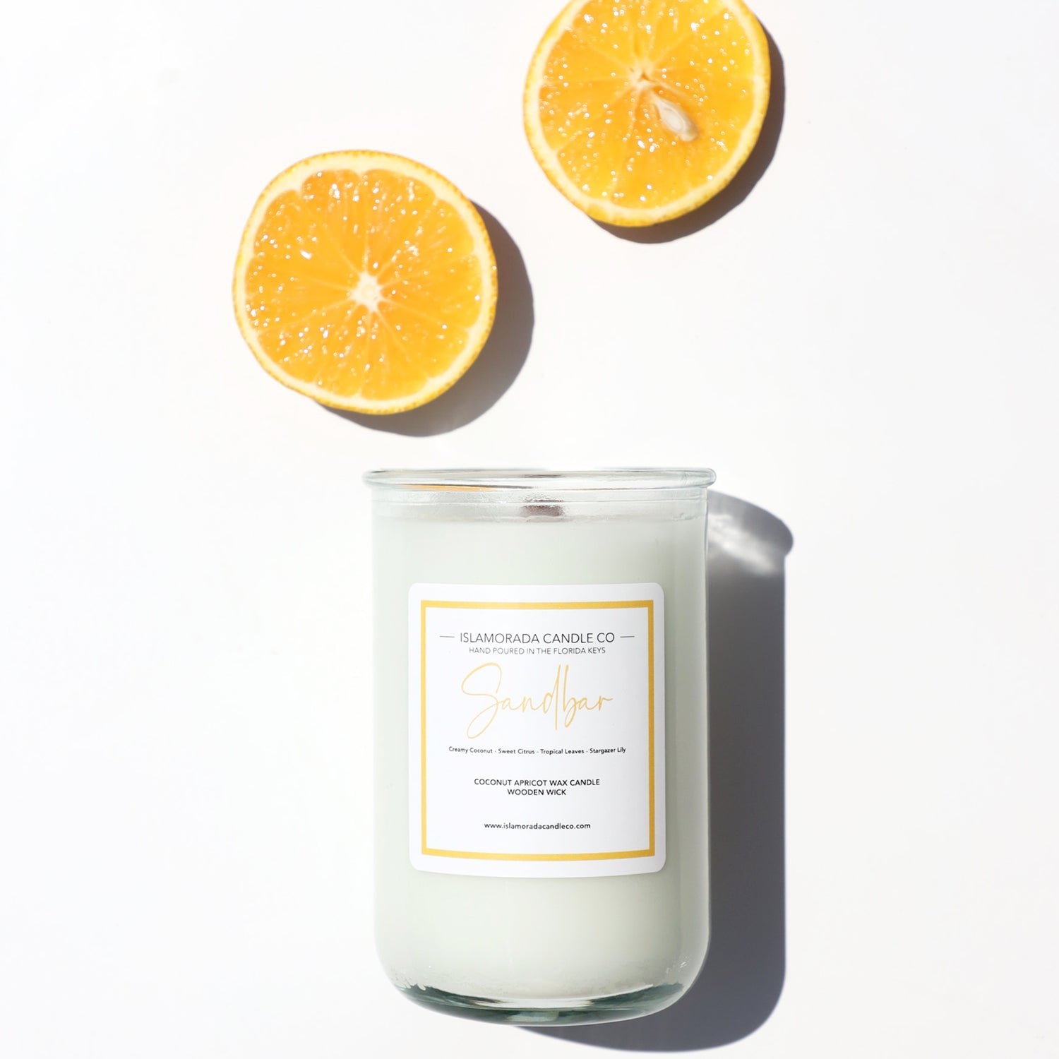 A Florida Keys inspired candle with wooden wick and Sandbar scent notes in a 12oz vessel