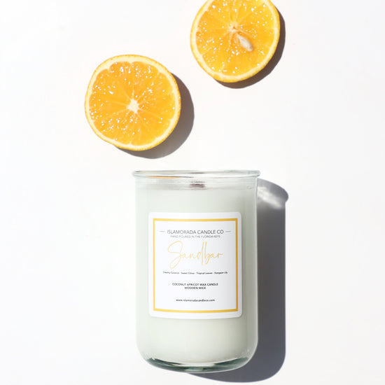 A Florida Keys inspired candle with wooden wick and Sandbar scent notes in a 12oz vessel