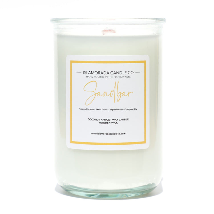 A Florida Keys inspired candle with wooden wick and Sandbar scent notes in a 12oz vessel