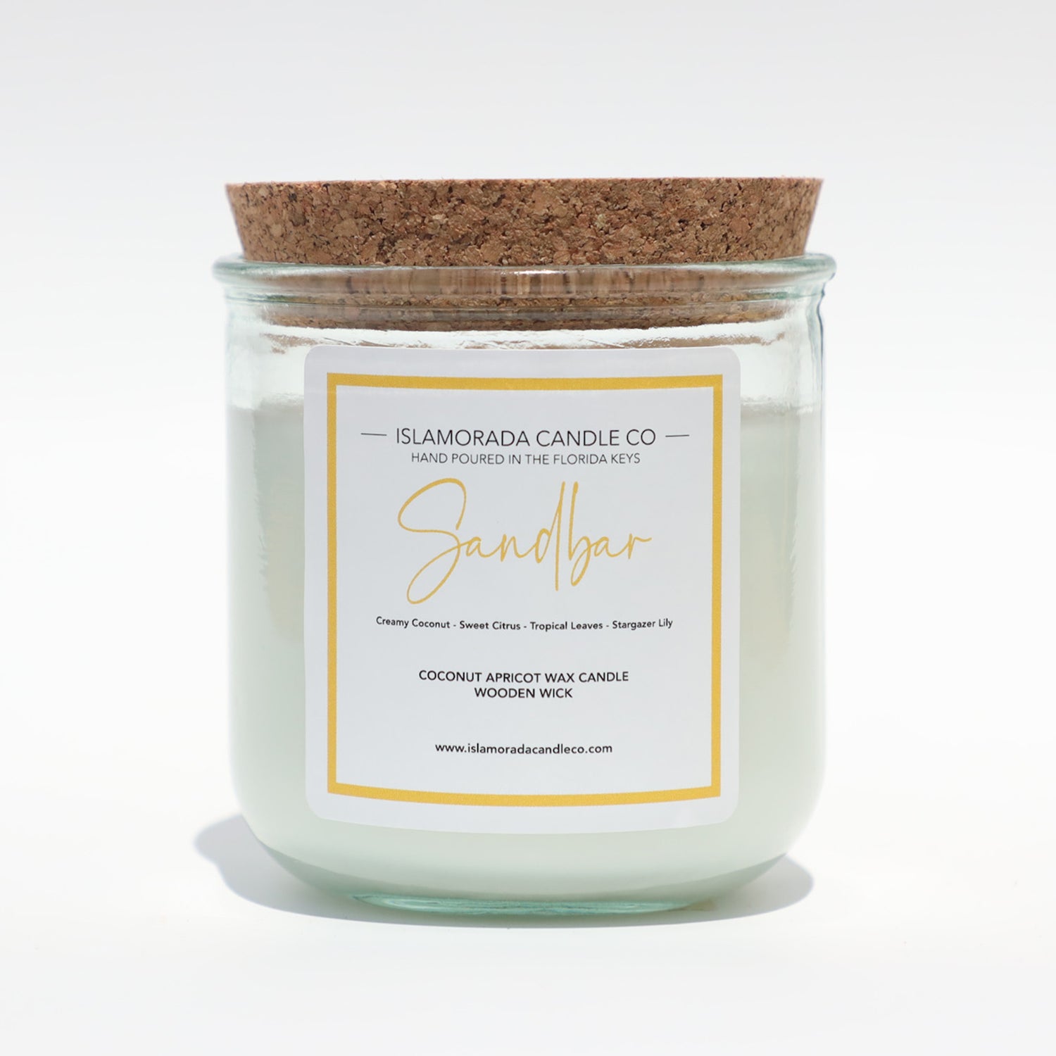 A Florida Keys inspired candle with wooden wick and Sandbar scent notes