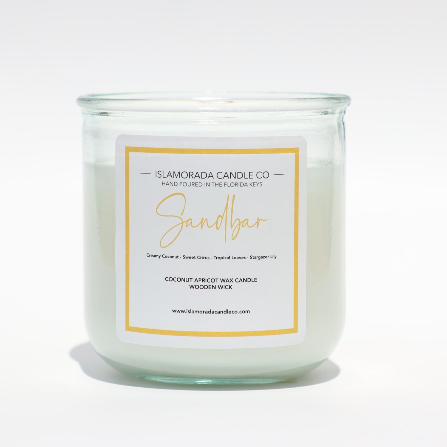 A Florida Keys inspired candle with wooden wick and Sandbar scent notes