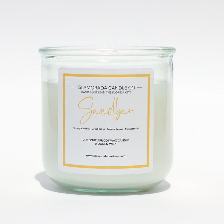 A Florida Keys inspired candle with wooden wick and Sandbar scent notes